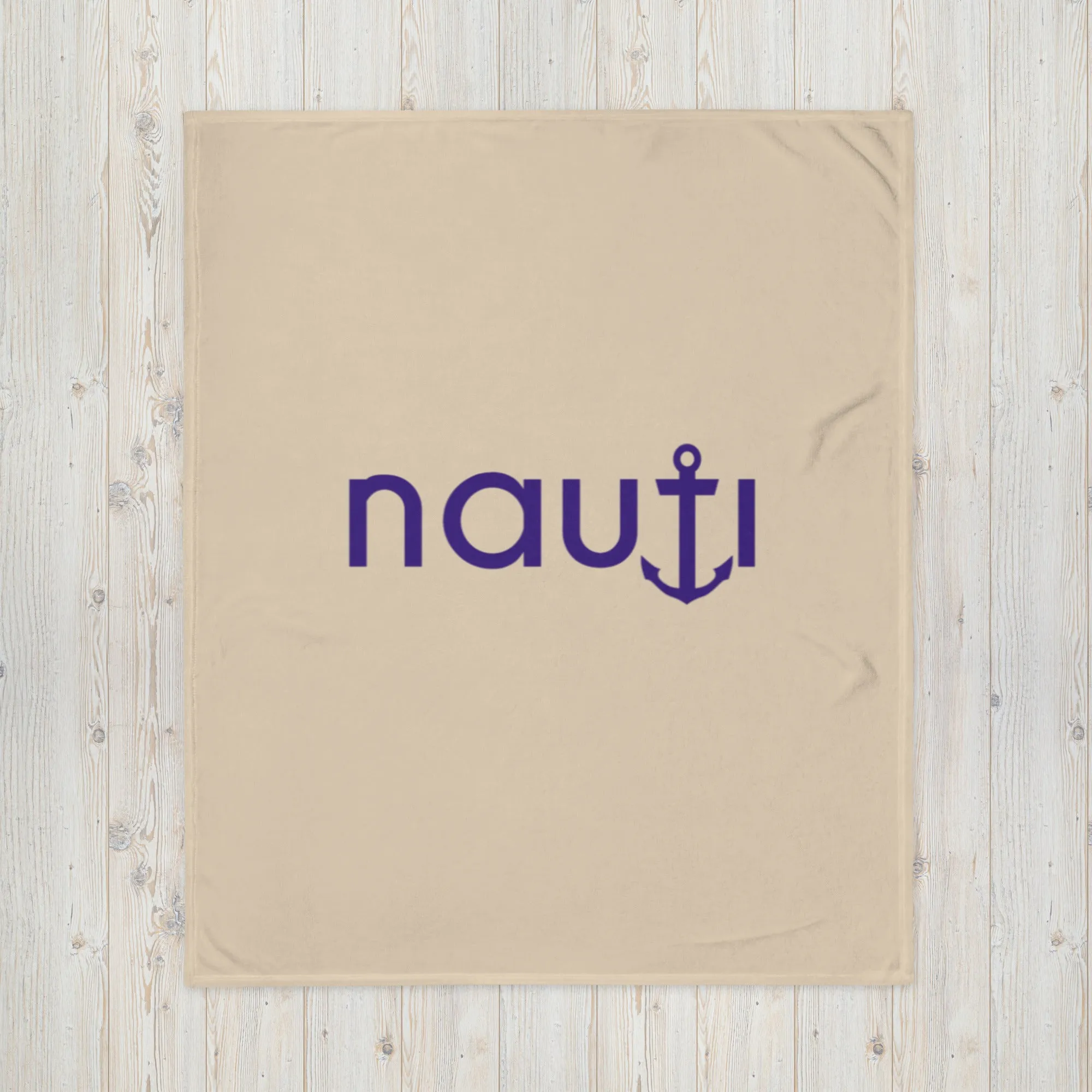 "NAUTI" blanket in champagne with navy logo