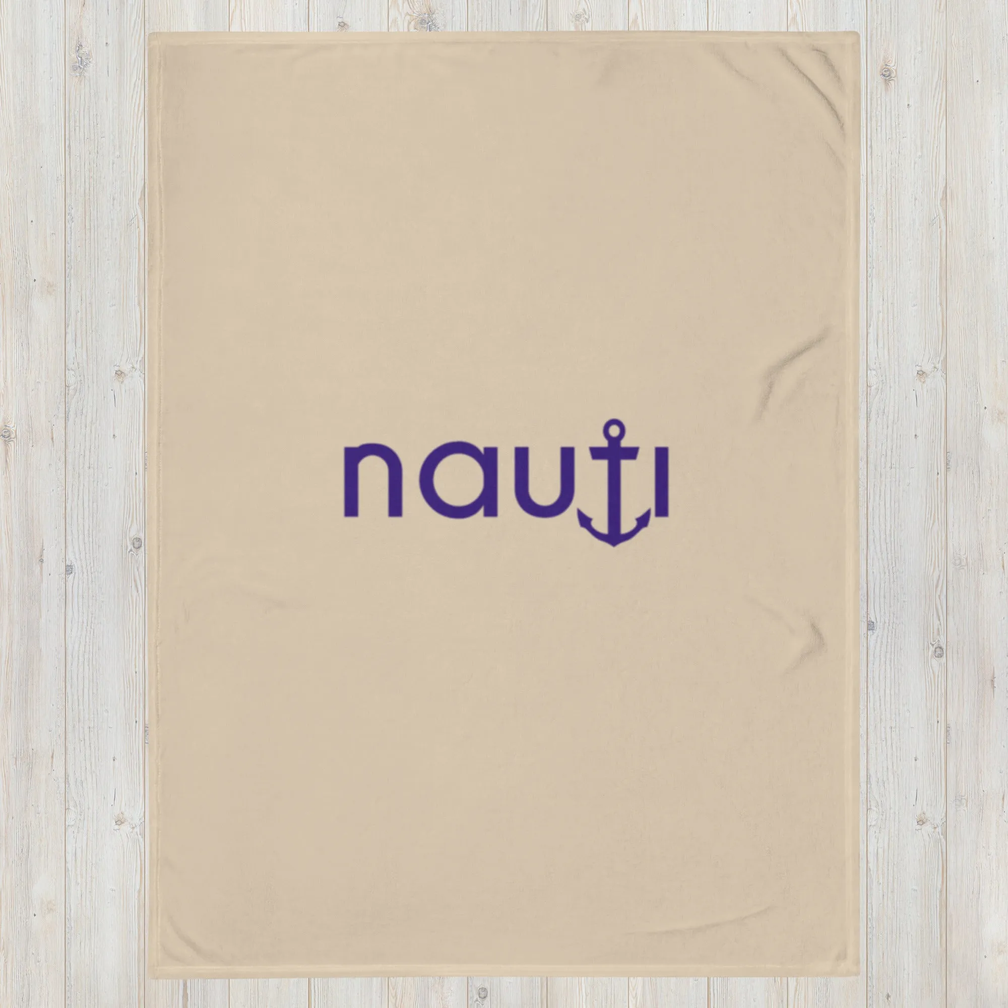 "NAUTI" blanket in champagne with navy logo